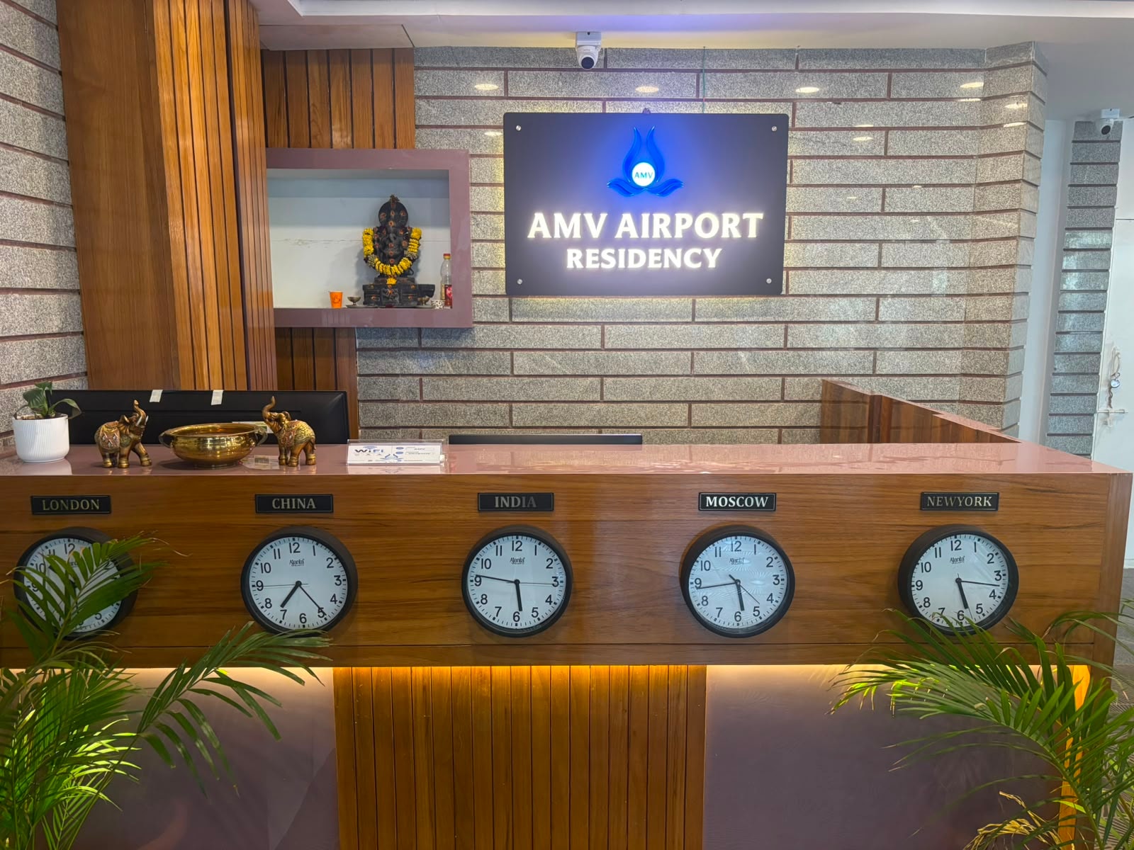 AMV Airport Residency reception desk with world clocks